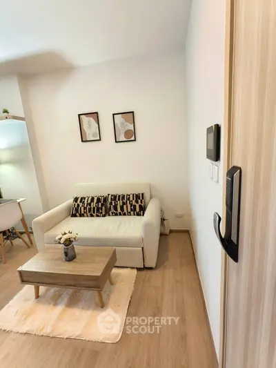 Cozy living room with modern decor and comfortable seating in a stylish apartment.