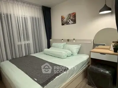 Cozy bedroom with modern decor and soft lighting, perfect for relaxation.