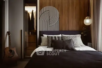 Stylish modern bedroom with cozy bedding and unique wall art
