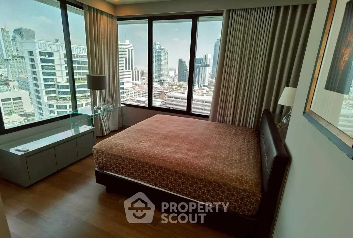 Luxurious bedroom with stunning city view in high-rise apartment