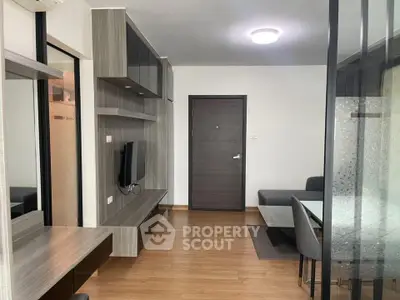 Modern living room with sleek furniture and wooden flooring