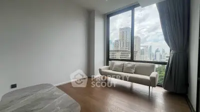 Modern living room with city view, featuring sleek wooden flooring and elegant sofa.