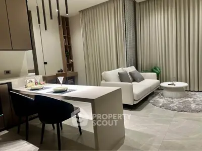 Modern living room with sleek furniture and elegant dining area