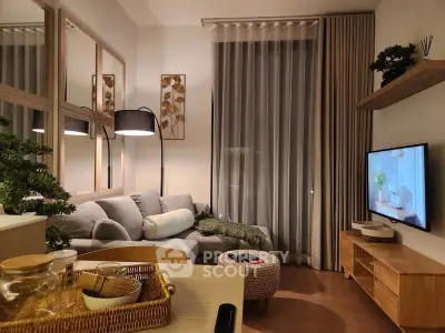 Stylish modern living room with cozy sofa, elegant decor, and wall-mounted TV, perfect for relaxation.