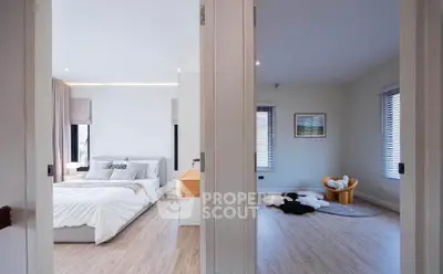 Spacious modern bedroom with elegant decor and natural light