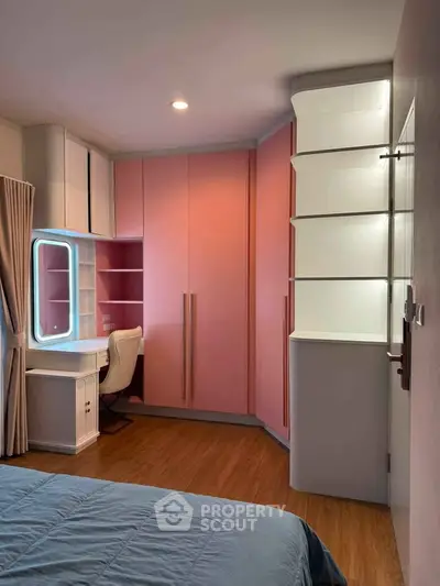 Chic bedroom with built-in study area and stylish pink wardrobe