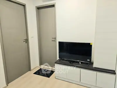 Modern living room with sleek TV stand and minimalist decor