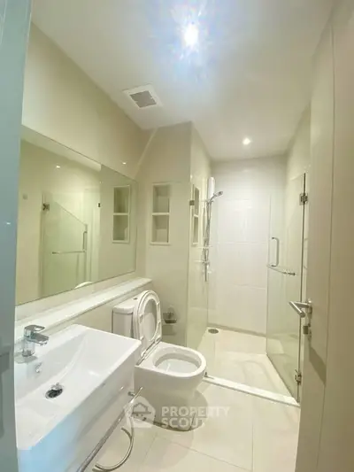 Modern bathroom with sleek design and glass shower enclosure