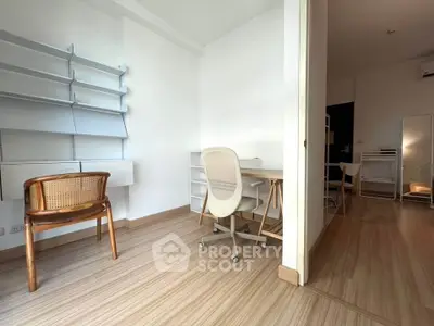 Modern study room with stylish chairs and shelving, perfect for productivity and comfort.