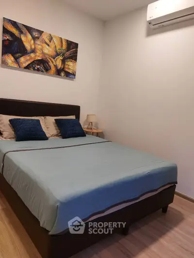 Cozy bedroom with modern decor and air conditioning unit