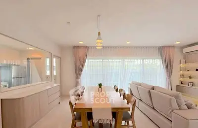 Spacious modern living room with dining area and natural light