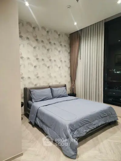 Modern bedroom with stylish decor and city view, featuring a comfortable bed and elegant curtains.