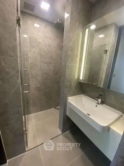 Modern bathroom with sleek design and spacious shower area