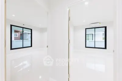 Spacious modern interior with large windows and glossy floors, perfect for customization.