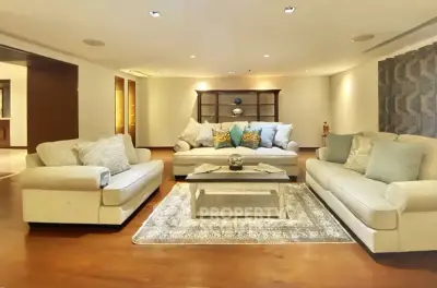 Spacious and elegant living room with plush sofas and stylish decor