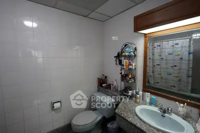 Cozy bathroom with modern fixtures and ample storage space