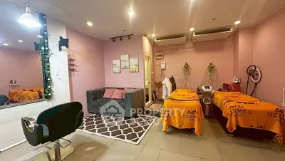 Chic salon interior with stylish decor and cozy seating area, perfect for relaxation and beauty treatments.