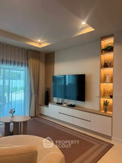 Elegant living room with modern TV setup and stylish decor