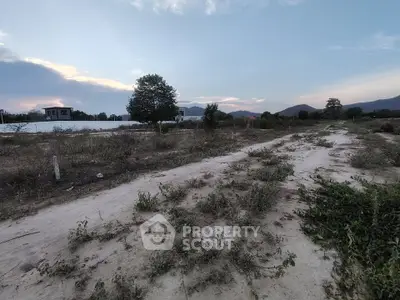 Expansive plot of land with scenic mountain views, perfect for development opportunities.