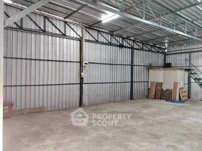 Spacious industrial warehouse with high ceilings and ample storage potential.