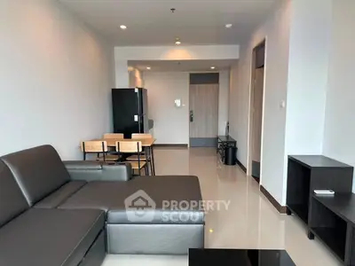 Modern living room with sleek furniture and open layout in a contemporary apartment.