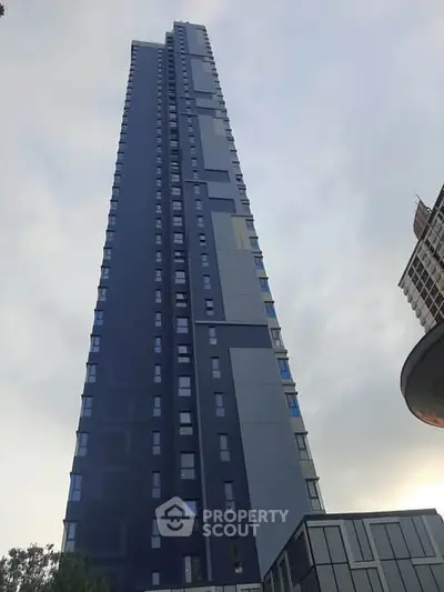 Stunning modern high-rise building with sleek architectural design and expansive city views.