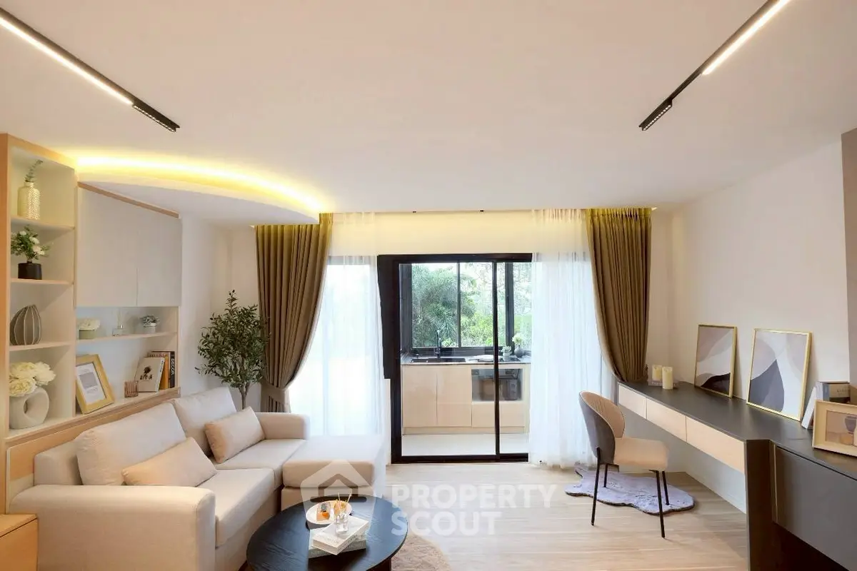 Modern living room with stylish decor and large windows for natural light.