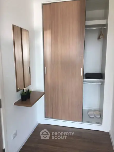 Modern apartment with sleek built-in wardrobe and minimalist decor