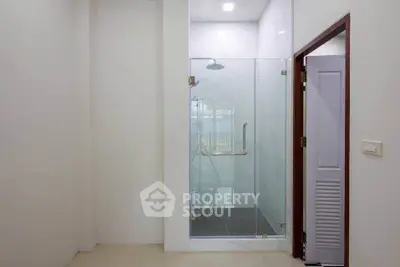 Modern bathroom with glass shower enclosure and sleek design