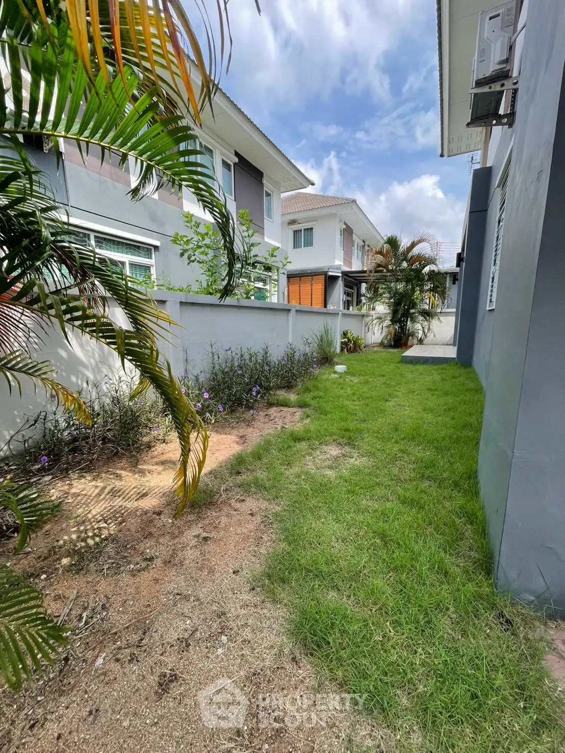 Charming suburban home with lush garden and modern exterior design, perfect for family living.