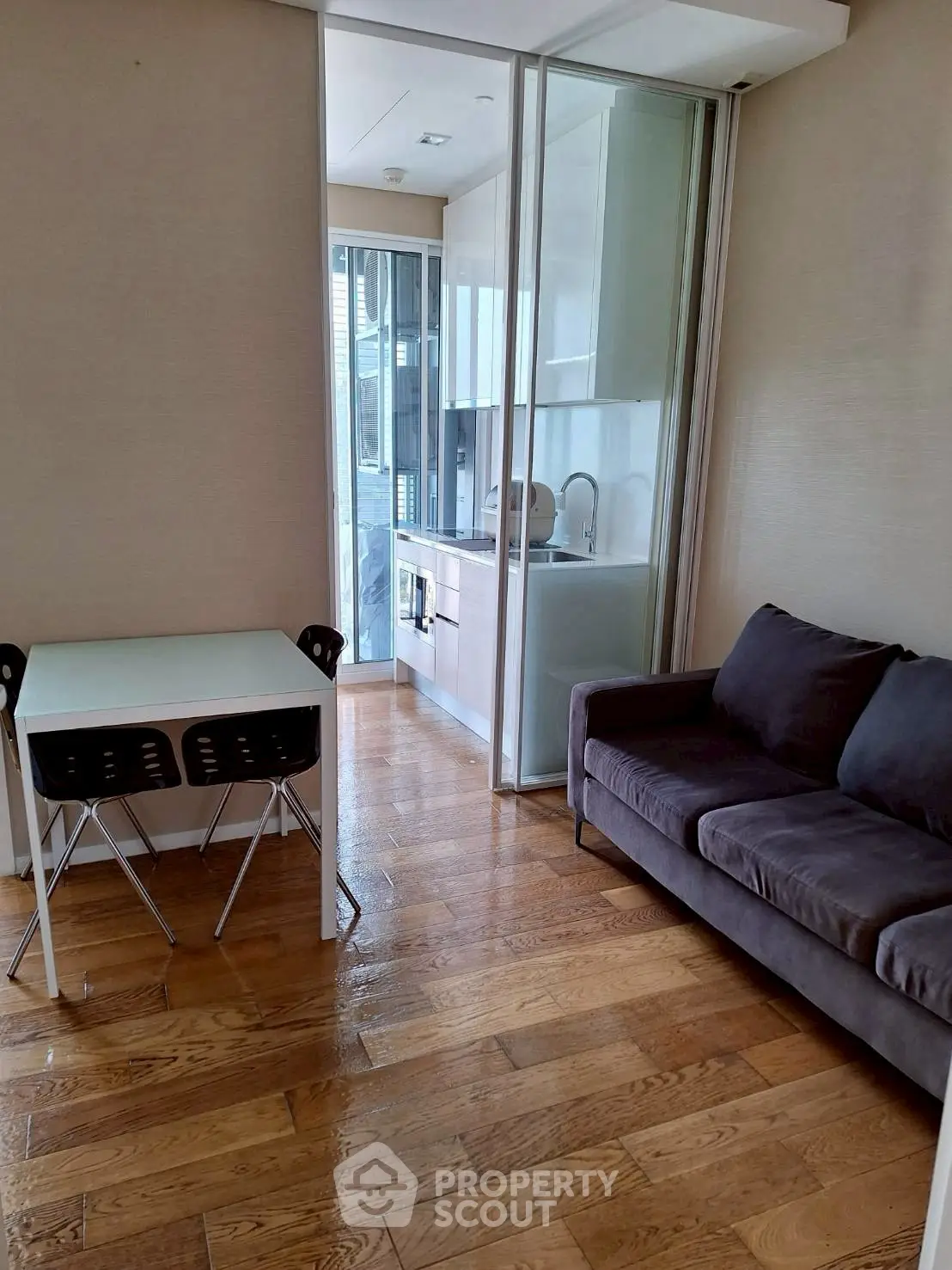 Modern apartment with cozy living area and sleek kitchen design