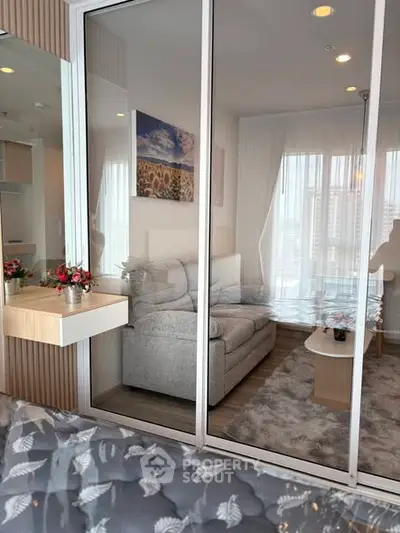 Modern living room with cozy sofa and stylish decor in a bright apartment.