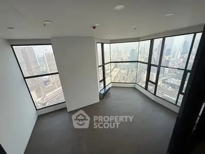 Stunning corner unit with panoramic city views from floor-to-ceiling windows.