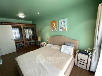 Charming bedroom with stylish decor and ample natural light