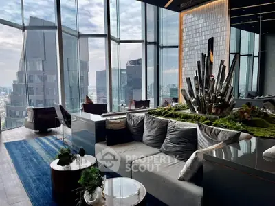 Luxurious high-rise living room with panoramic city views and modern decor.