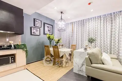 Modern open-plan living and dining area with elegant decor and natural light.