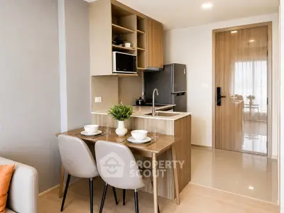 Modern compact kitchen with dining area in stylish apartment