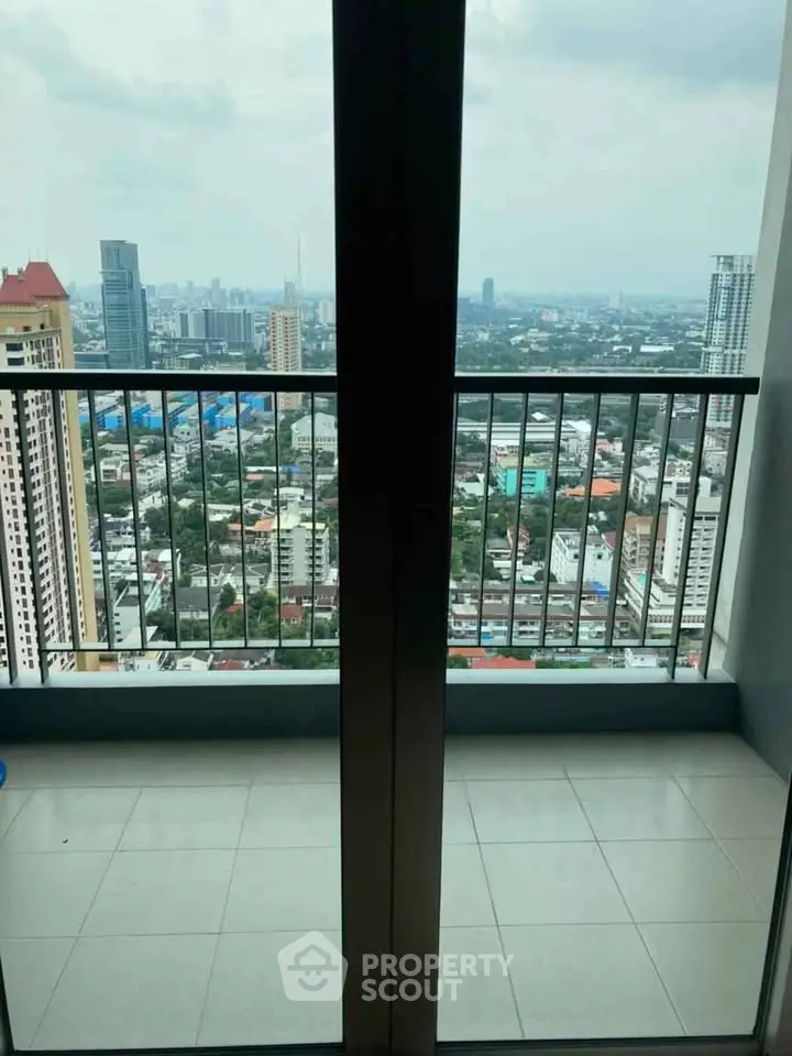 Stunning cityscape view from a high-rise balcony, perfect for urban living.