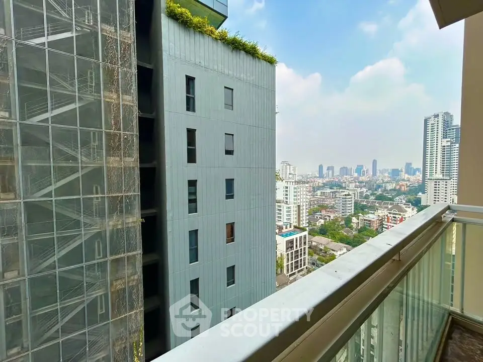 Stunning cityscape view from a modern high-rise balcony, perfect for urban living enthusiasts.