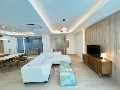 Spacious modern living room with open kitchen and elegant decor