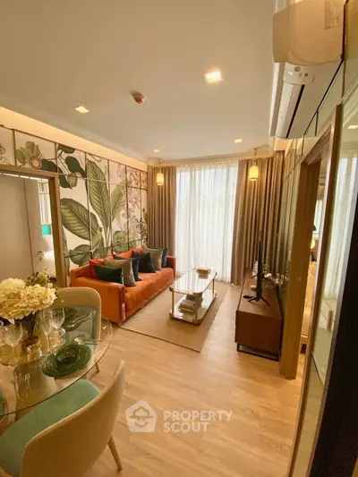 Stylish living room with vibrant decor and natural light in modern apartment.