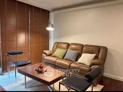 Cozy living room with leather sofa and modern decor