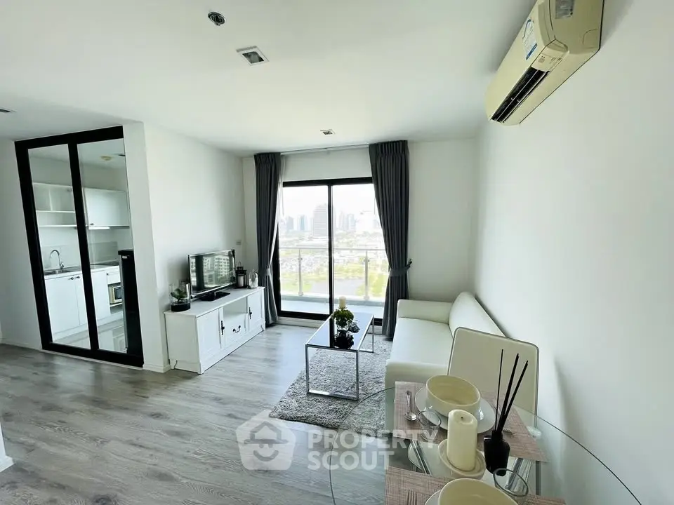 Modern living room with city view, sleek furniture, and open kitchen layout