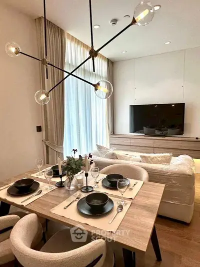 Modern living room with elegant dining area and stylish lighting