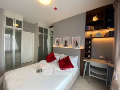 Modern bedroom with stylish decor, built-in wardrobe, and cozy workspace.