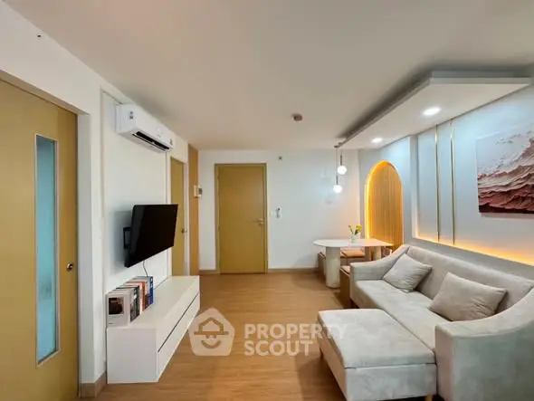 Modern living room with stylish decor and cozy seating area, perfect for relaxation and entertainment.