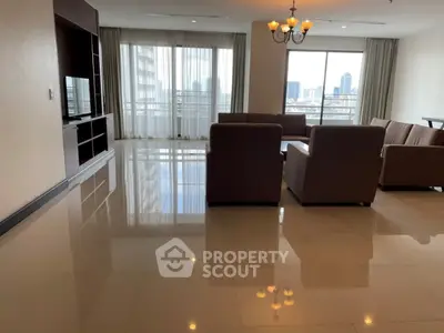 Spacious living room with city view and elegant furnishings in modern apartment.