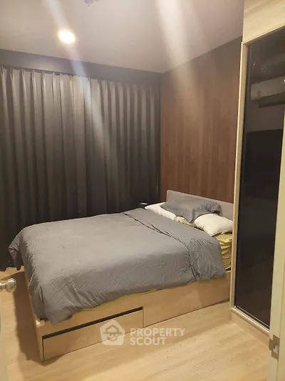 Cozy bedroom with modern decor and ample natural light