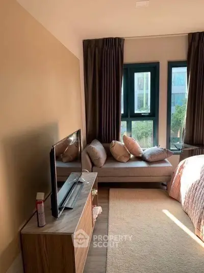 Cozy bedroom with large windows and stylish decor in modern apartment