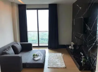 Modern living room with large window and stylish black marble wall